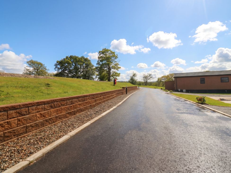 An outdoor scene with a road leading to a building at Number 35