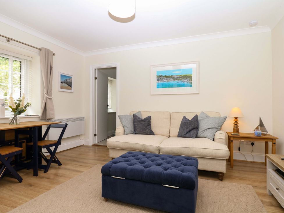 A living room with a sofa and dining table at 2 Sheplegh Court Blackawton near Dartmouth