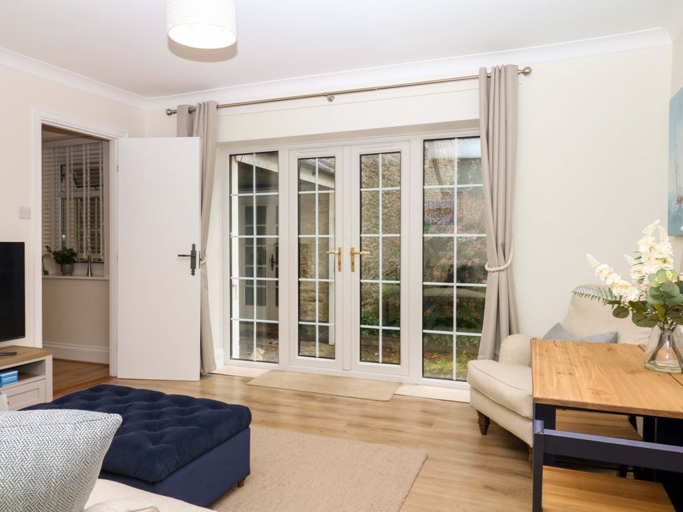 A living room with a sofa and coffee table at 2 Sheplegh Court Blackawton near Dartmouth