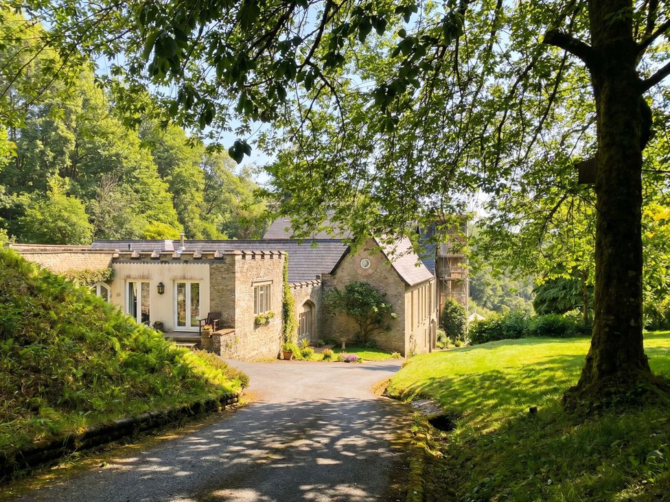 A house with a driveway and trees at 2 Sheplegh Court Blackawton near Dartmouth