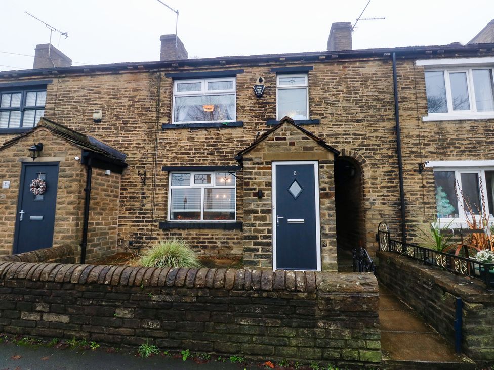A residential house with a front door and windows at Franbols Cottage in Shelf