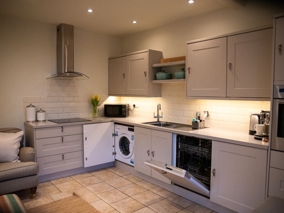 A kitchen with sink and appliances at The End Low Ham near Langport