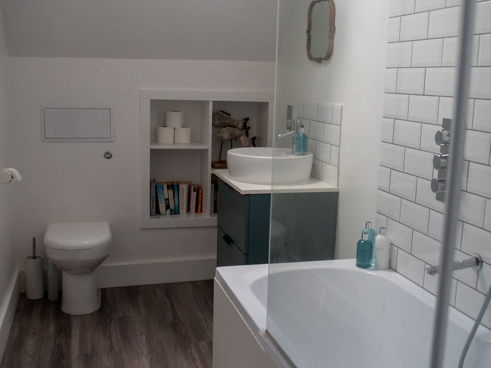 A bathroom with a bathtub and a toilet at The End in Low Ham near Langport