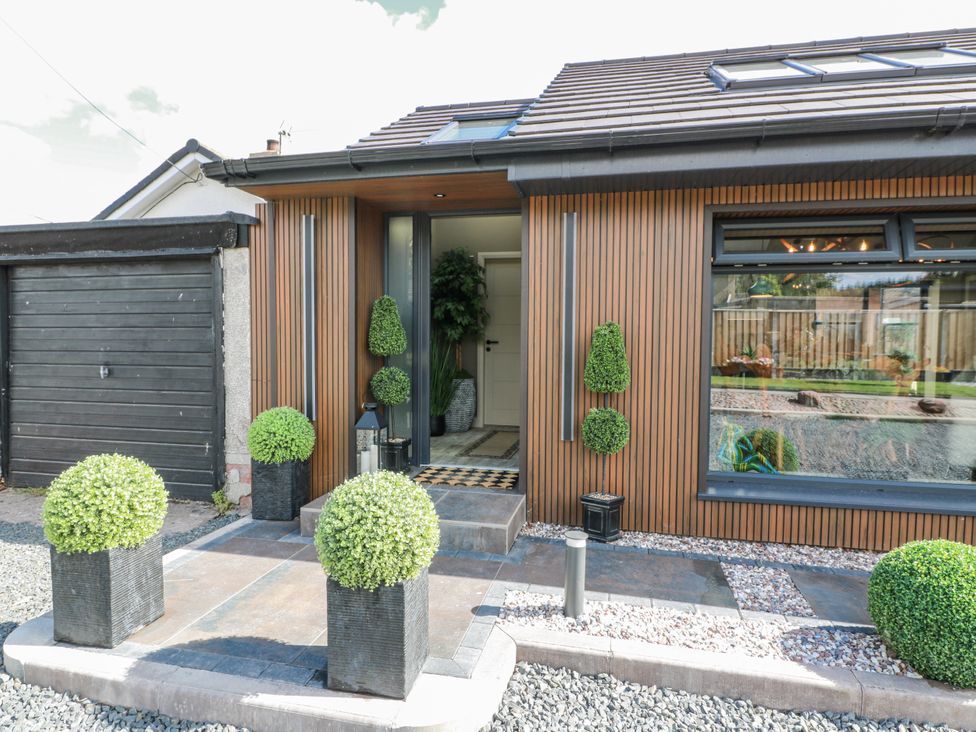 An entrance with planters and a door at Scotia At The Brig Annan