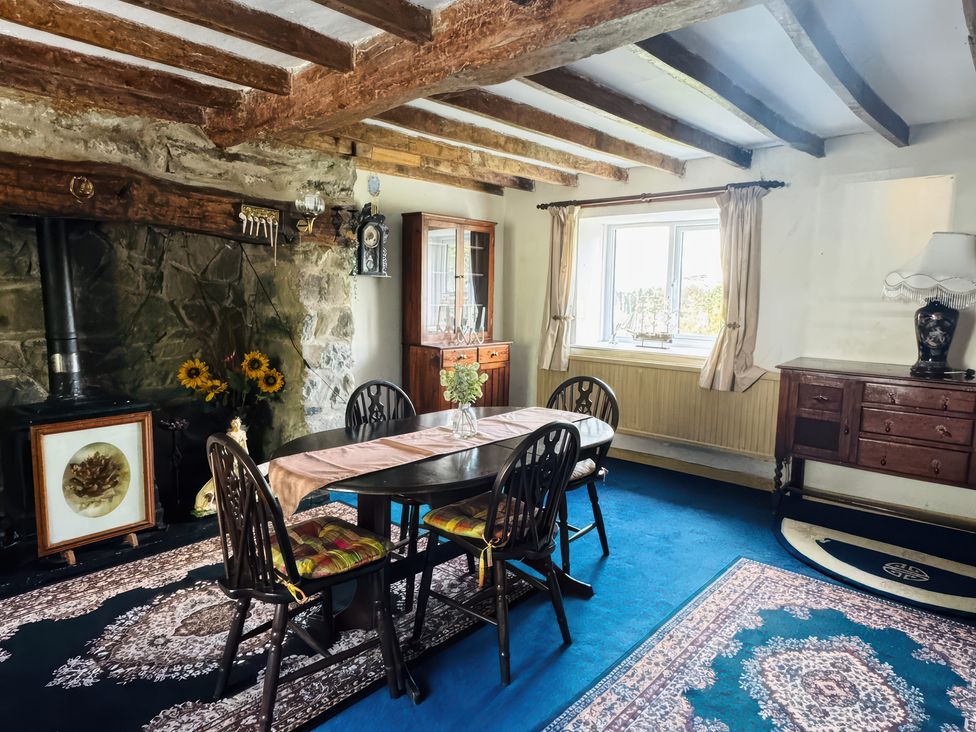 A dining room with a table and chairs at The Old Post Office in null