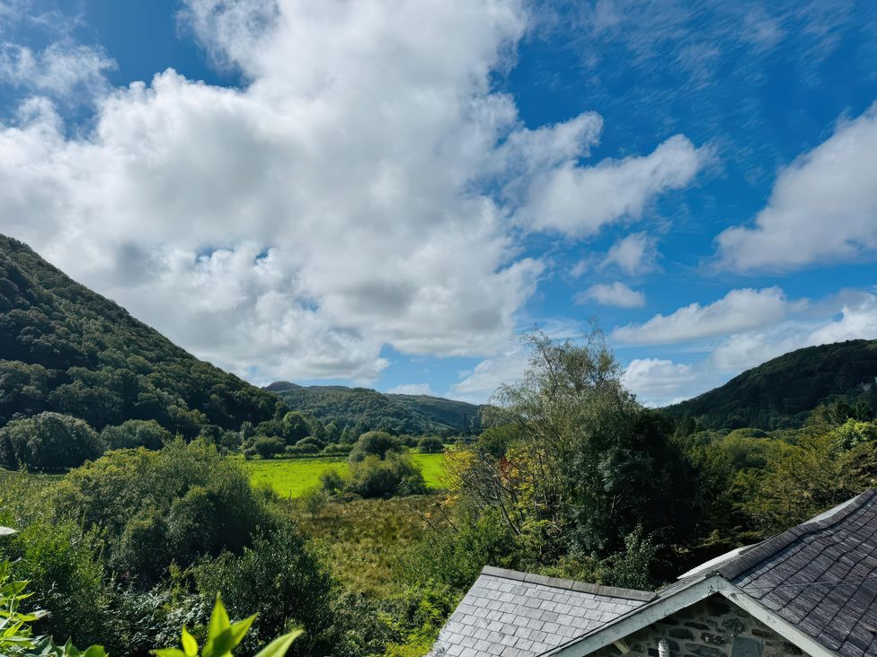 A scenic view of mountains and fields at the Old Post Office in null