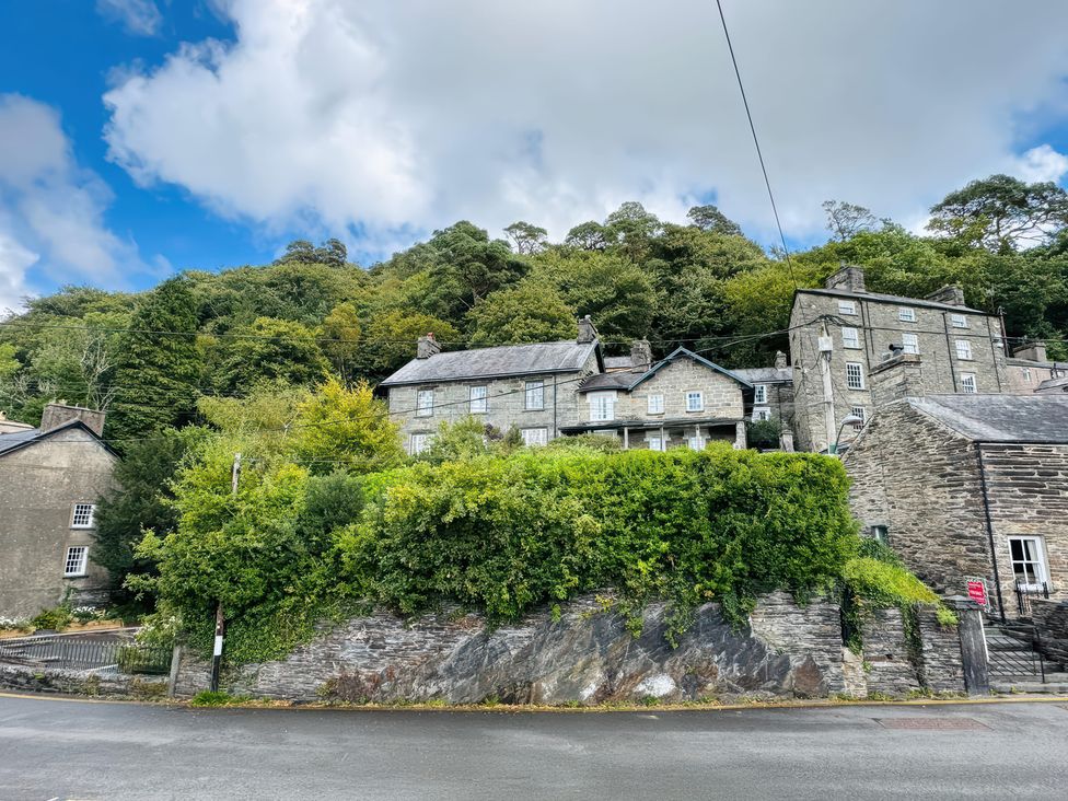 A row of houses with greenery on a hill at The Old Post Office in null