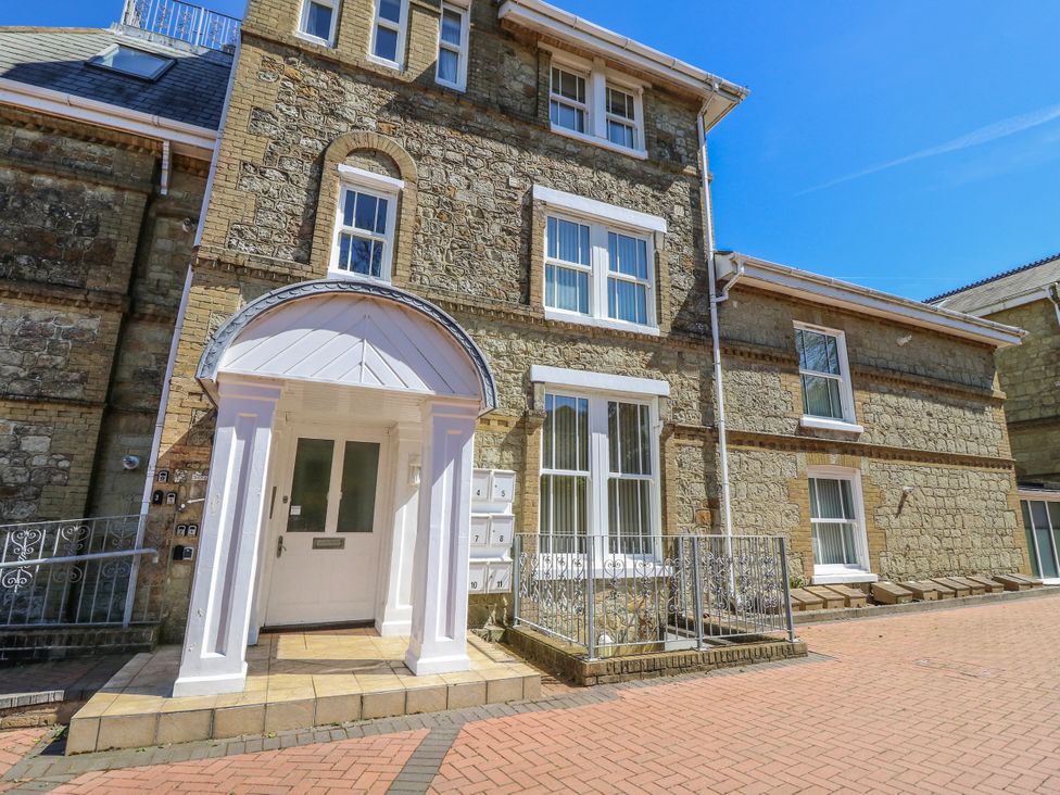 An exterior view of a building with a front entrance and balconies at 6 Priory in Shanklin