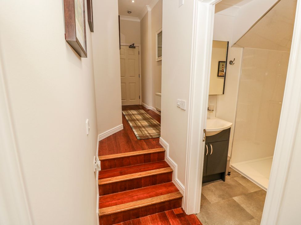 A bathroom with a sink and shower at 6 Priory, Shanklin