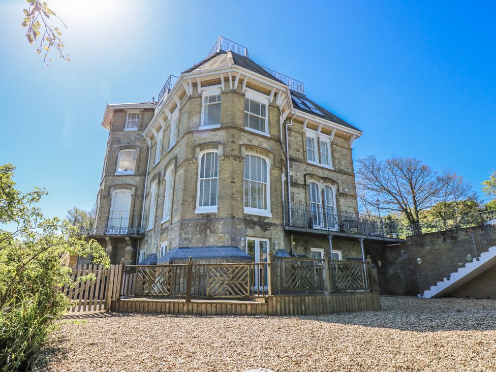 An outdoor view of a multi-story house with a balcony at 6 Priory in Shanklin