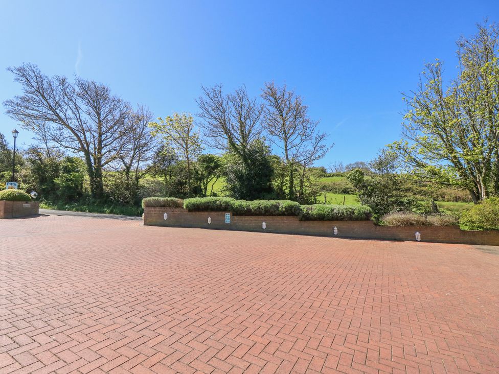 An outdoor area with trees and a paved surface at 6 Priory in Shanklin
