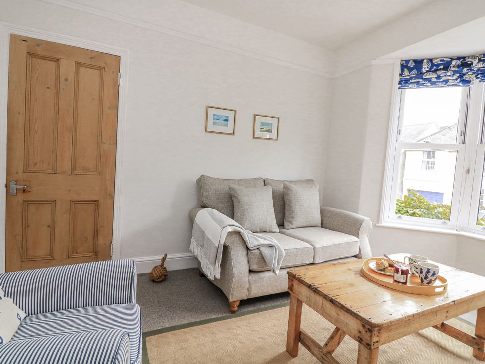 A living room with a sofa and coffee table at Shipwrights in Salcombe