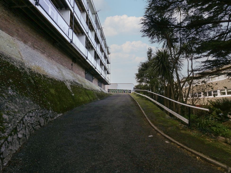 A pathway leading to a building at 20 Heath Court in Brixham