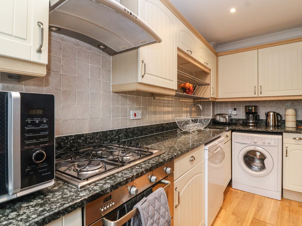 A kitchen with appliances and countertop in 122 Longridge Way Weston-Super-Mare