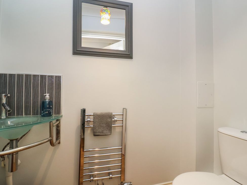 A bathroom featuring a toilet and hand wash basin at 122 Longridge Way Weston-Super-Mare
