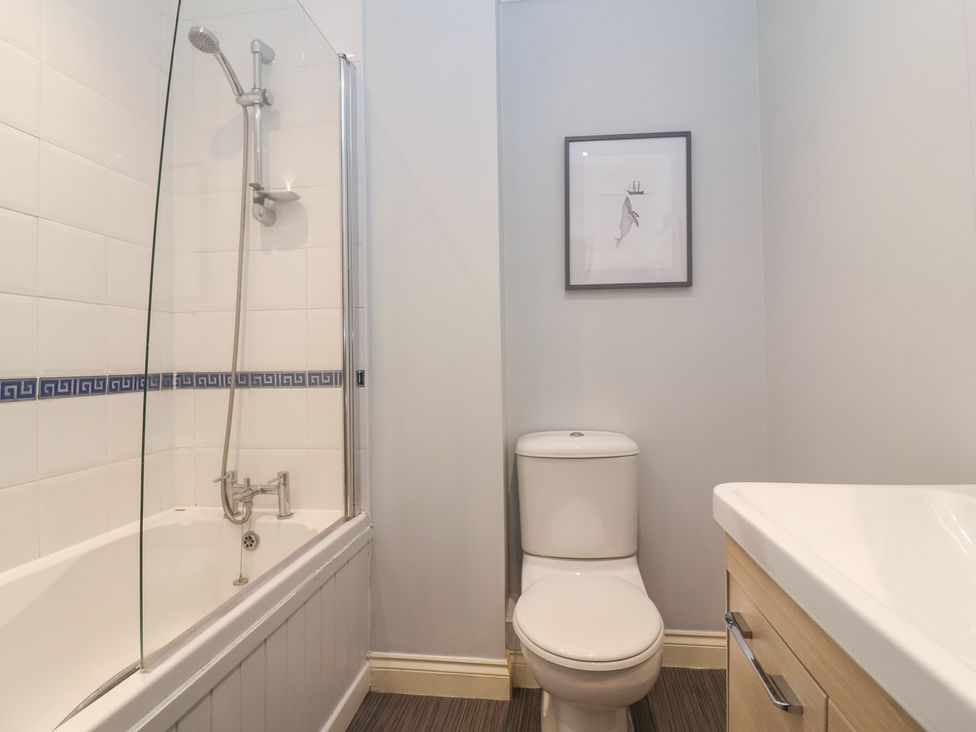 A bathroom with a bathtub and shower unit at 122 Longridge Way Weston-Super-Mare