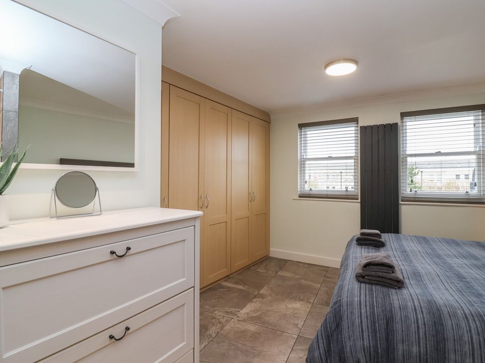 A bedroom with a dresser and wardrobe at 122 Longridge Way Weston-Super-Mare