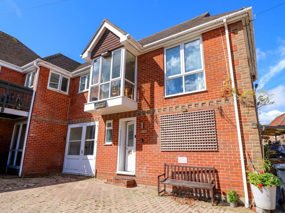 A house exterior with a bench and plants at Riverview in Hamble