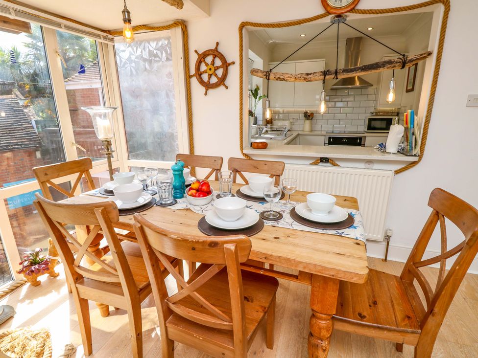A dining room with a table set for lunch at Riverview in Hamble