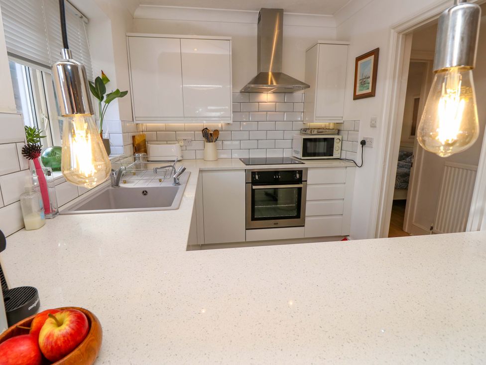 A kitchen with sink and oven at Riverview in Hamble
