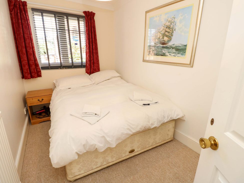 A bedroom with a bed and bedside table at Riverview in Hamble