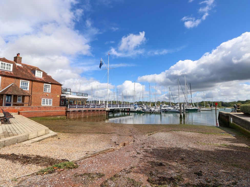 A marina with boats at the dock and a building at Riverview in Hamble
