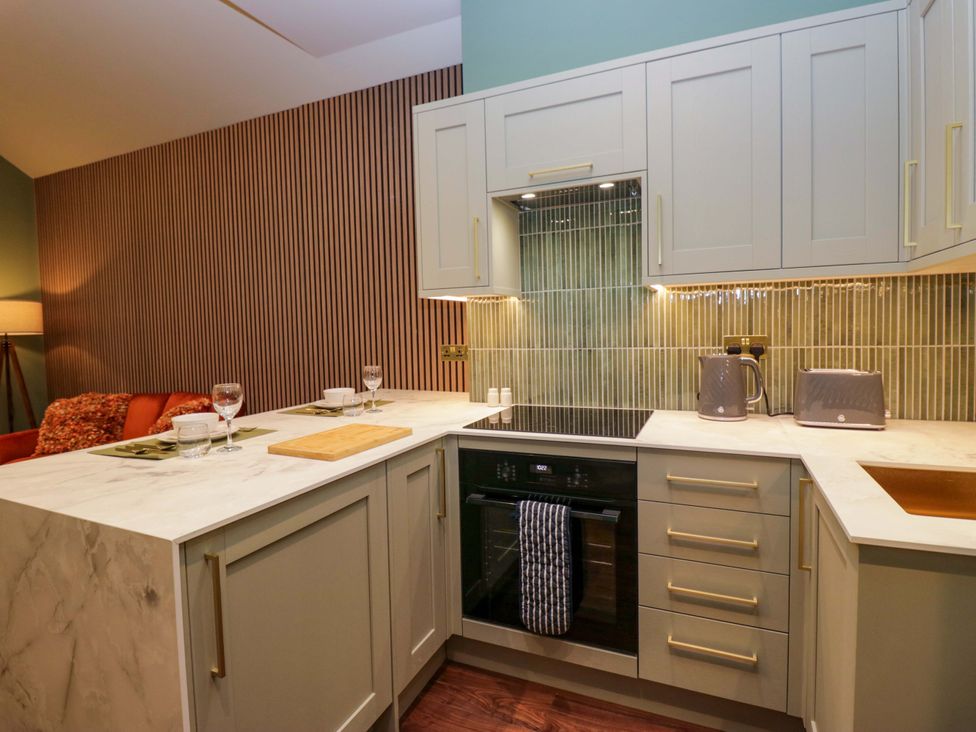A kitchen with appliances and countertops at The Studio in Windermere