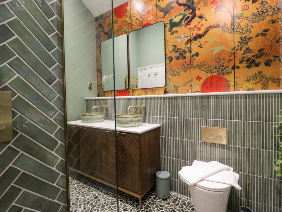 A bathroom with a sink and toilet at The Studio in Windermere