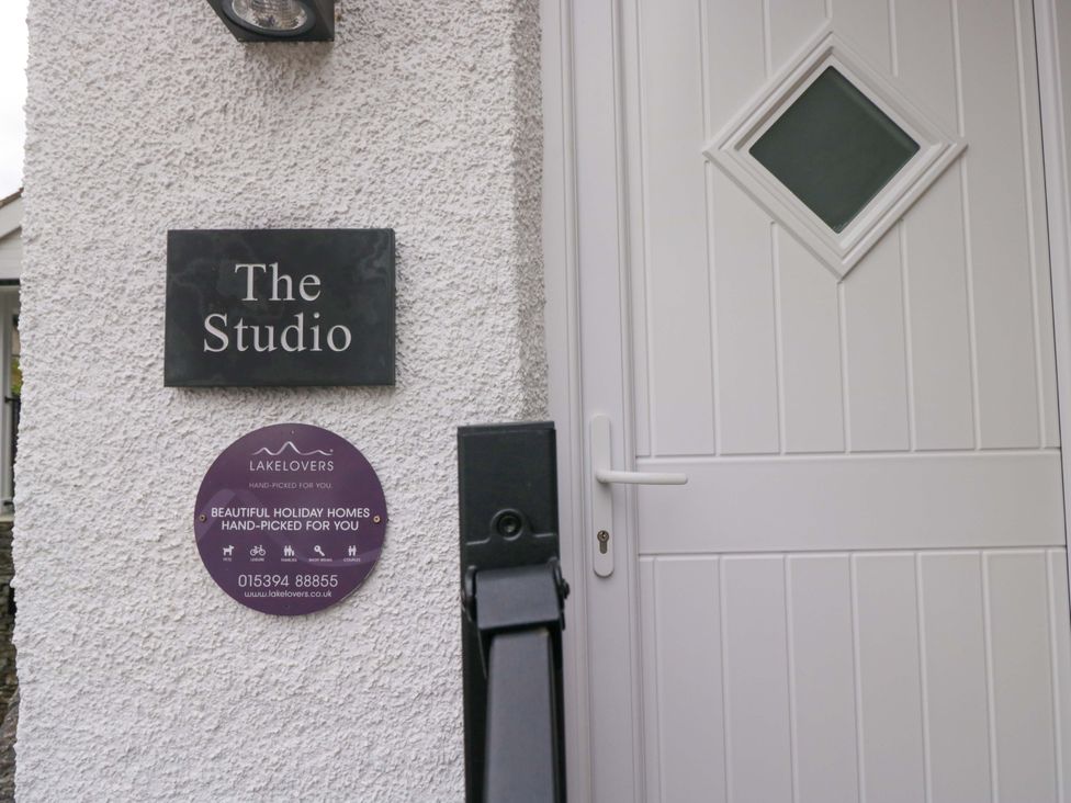 An entrance with a door and a name plaque at The Studio in Bowness-On-Windermere