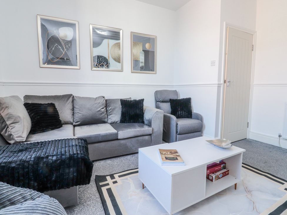 A living room with a sofa and a coffee table at Bliss in Lytham St. Annes
