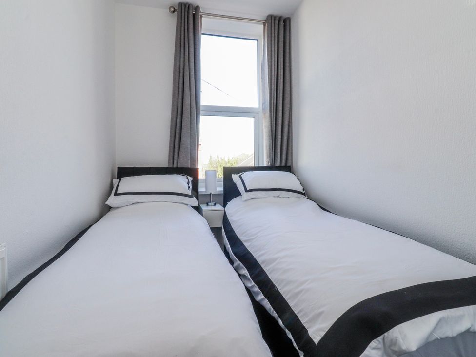 A bedroom with two single beds at Bliss in Lytham St. Annes