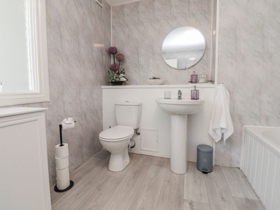 A bathroom with a sink and toilet at Bliss in Lytham St. Annes