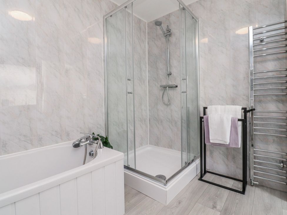 A bathroom with a bathtub and shower at Bliss in Lytham St. Annes