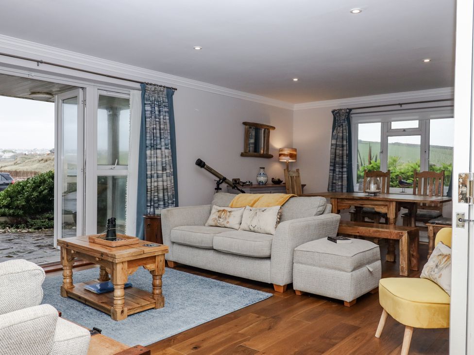 A living room with a coffee table and a sofa at 8 Thurlestone Rock in Kingsbridge