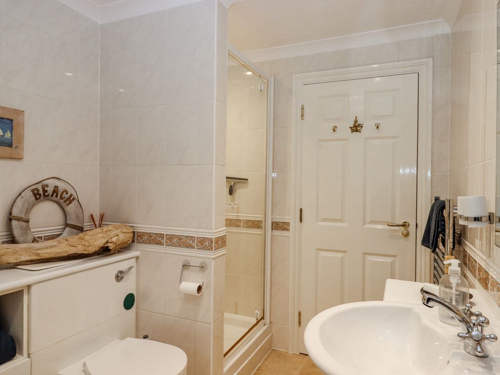 A bathroom with a shower and sink at 8 Thurlestone Rock in Kingsbridge