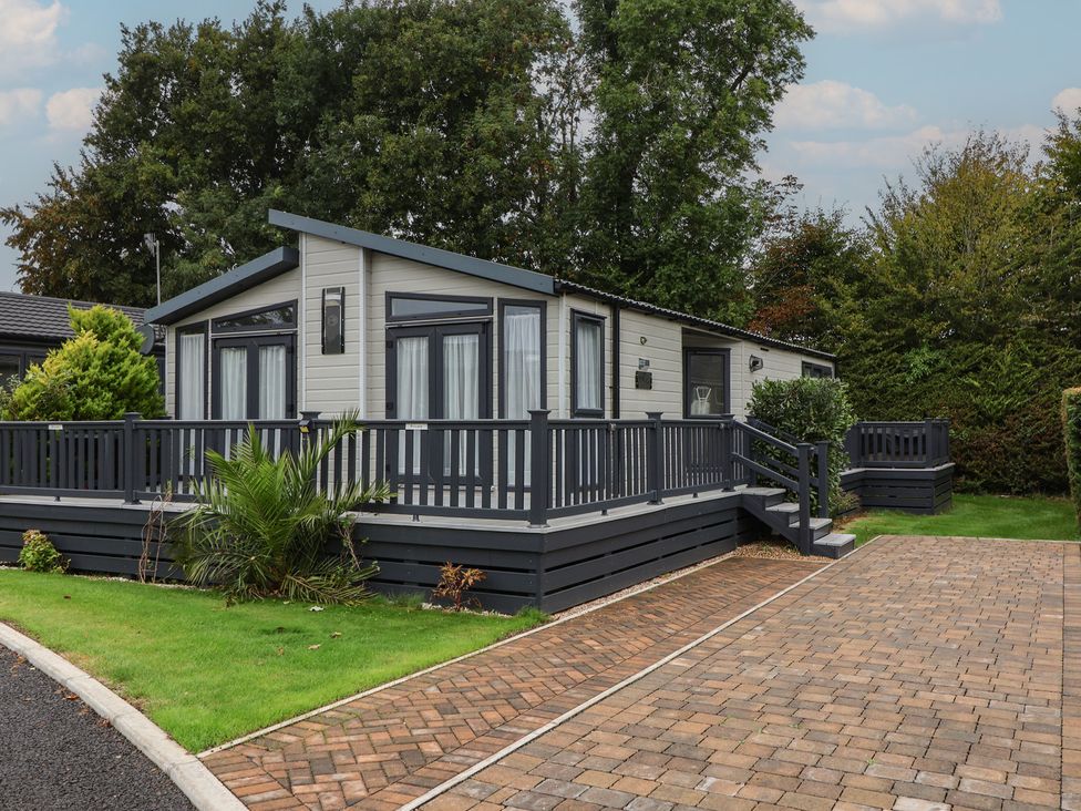 A house with a deck and garden at Whistler in Wimborne