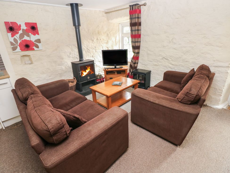 A living room with sofas and a coffee table at Stable Cottage in Clarbeston Road