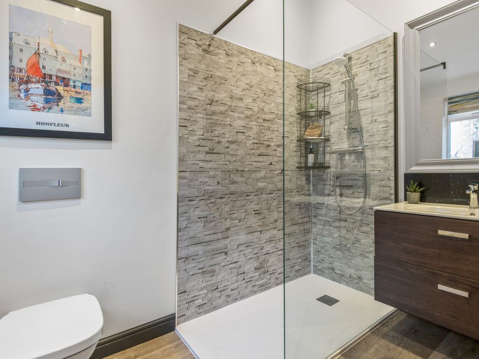 A bathroom with a shower and sink at Newlands in Yelverton
