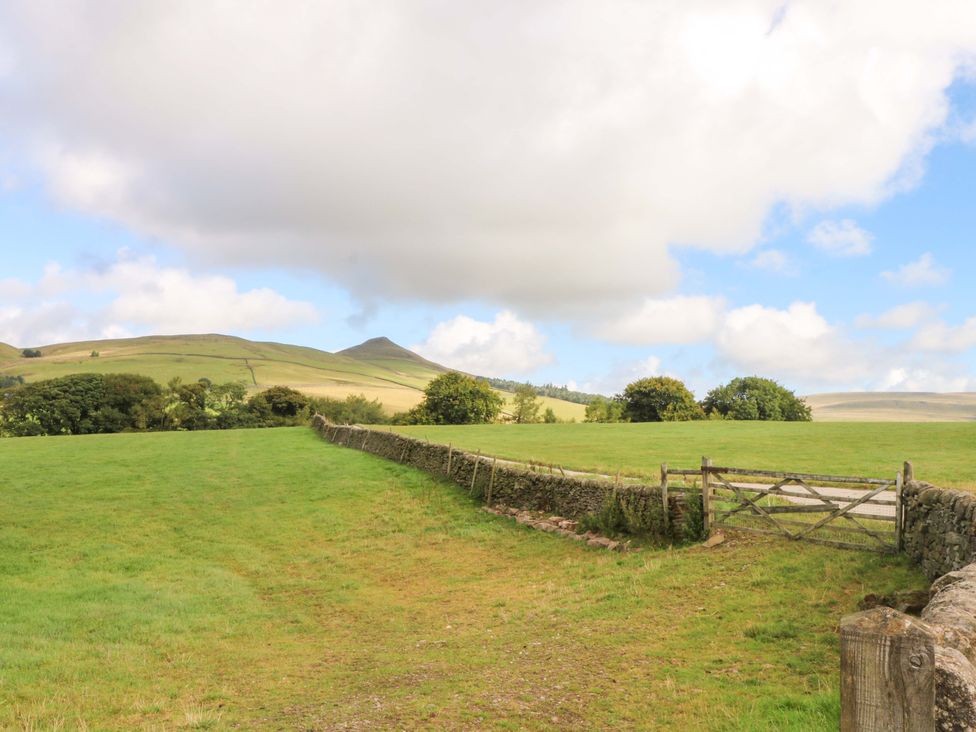 A field with a gate and trees at The Old Shippon 