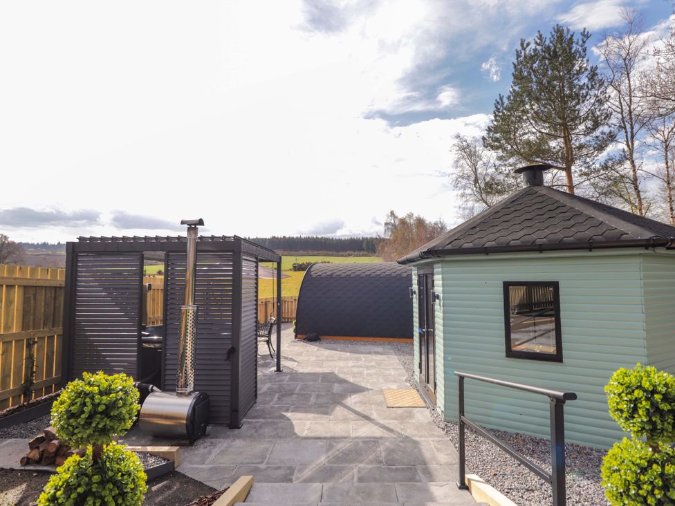 An outdoor area with a gazebo and circular structure at Little Oaks in Poyntzfield near Cromarty