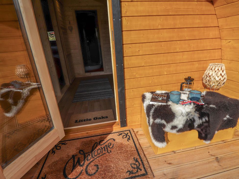 An entryway with a welcome mat and a table at Little Oaks in Poyntzfield near Cromarty