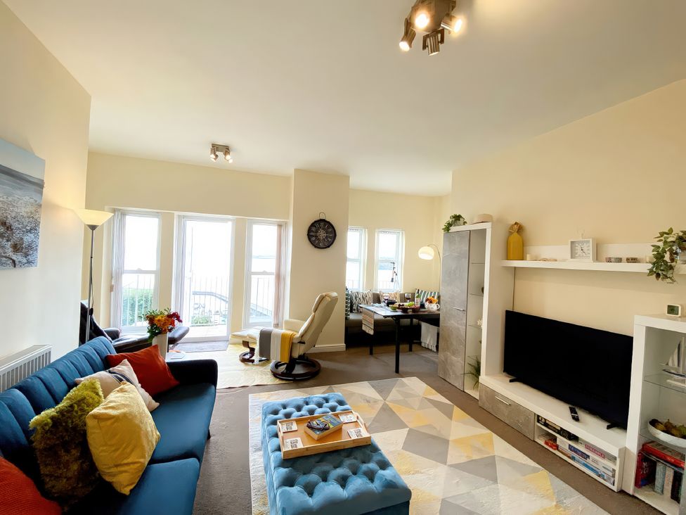 A living room with a sofa and coffee table at Number 1 Marina Court in Torquay