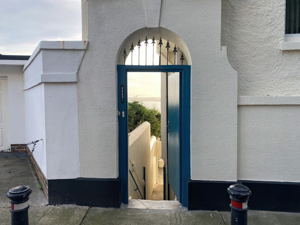 A blue door leading to stairs at Number 1 Marina Court in Torquay