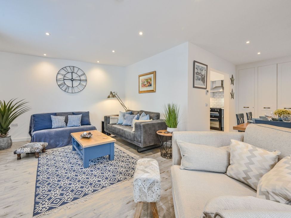 A living room with sofas and a coffee table at Number 2 Ellington Court Apartment in Torquay