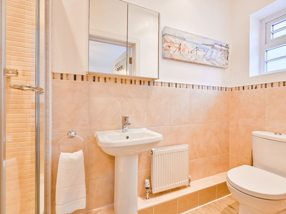 A bathroom with a shower, sink, and toilet at Number 2 Ellington Court Apartment in Torquay