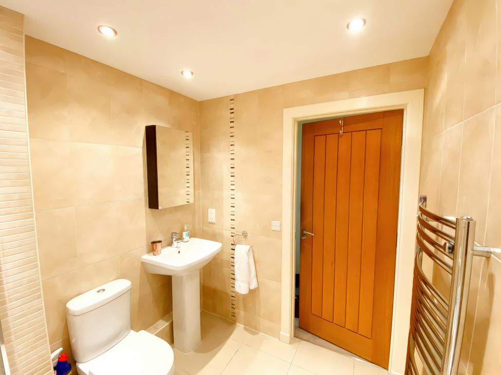 A bathroom with a sink and toilet at Sea View Apartment, Ellington Court in Torquay