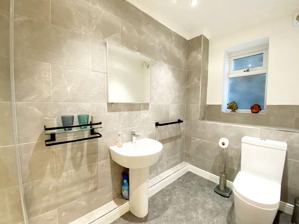 A bathroom with a sink and toilet at Ockedon House Apartment A in Torquay