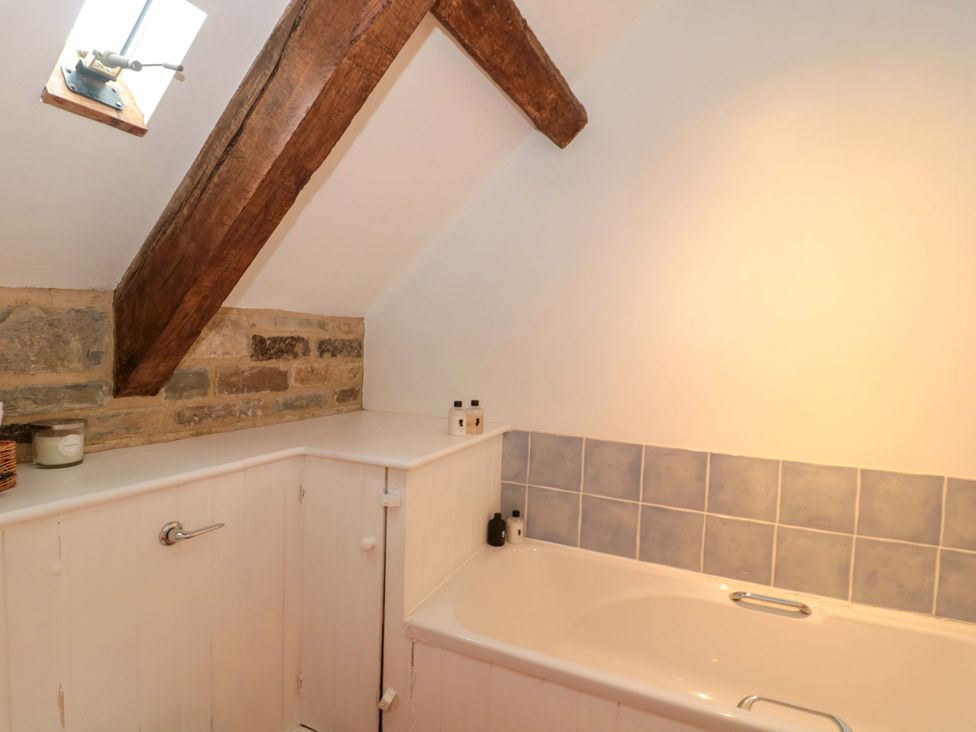 A bathroom with a bathtub and sink at The Farmhouse in Langport
