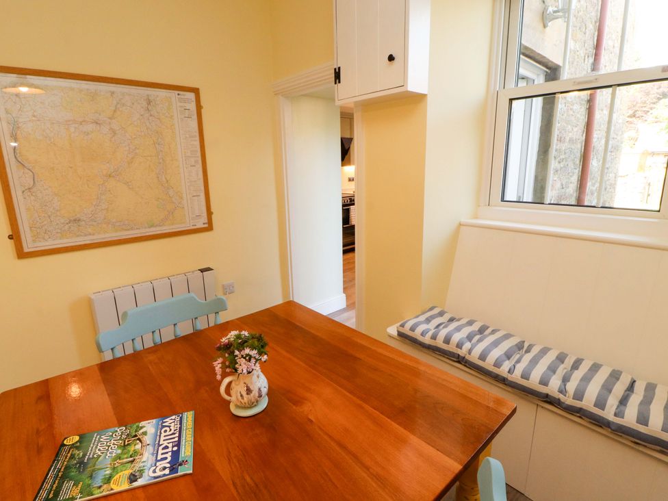 A dining room with a table and chairs at East View in Kirkby Stephen