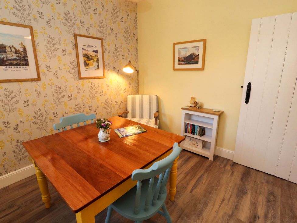 A dining room with a table and chairs at East View in Kirkby Stephen